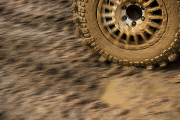 close-up shot of wheel in dirt.