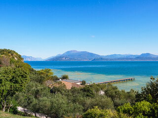 Fototapeta na wymiar Sirmione beach with Lake Garda