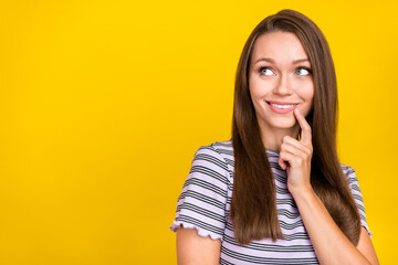 Photo of charming minded dreamy woman good mood look empty space idea isolated on yellow color...