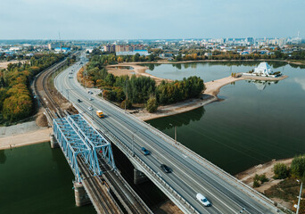 Obraz premium Top up aerial drone view of road and traffic in Kazan city during sunny day.