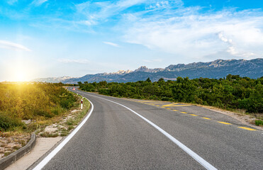 Scenic road. The road is surrounded by a magnificent natural landscape.