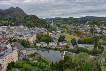 Lourdes, France - 9 Oct 2021: Views of the Rosary Basilica and Gave de Pau river from the Chateau Fort de Lourdes