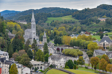 Lourdes, France - 9 Oct 2021: Views of the Rosary Basilica and Gave de Pau river from the Chateau Fort de Lourdes