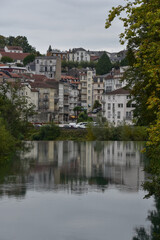 Fototapeta na wymiar Lourdes, France - 9 Oct 2021: Scenic views along the Gave de Pau river as it flows through the town of Lourdes