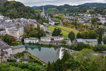 Lourdes, France - 9 Oct 2021: Views of the Rosary Basilica and Gave de Pau river from the Chateau Fort de Lourdes