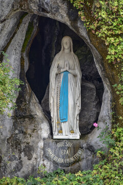 Lourdes, France - 9 Oct 2021: Statue of the Virgin Mary within the Massabielle Grotto in Lourdes