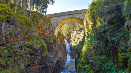 Cauterets, France - 10 Oct, 2021: The Pont d'Espagne bridge over the Gave de Marcadau in the Pyrenees National Park