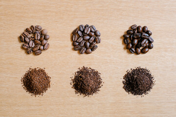 Set of coffee beans and ground coffee, Different level of roasting, Dark, Medium and light roast