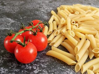 Various types of pasta, Raw pasta set and tomato, set
