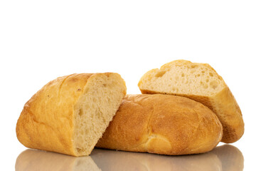 One whole and two halves of fragrant ciabatta, close-up, isolated on white.