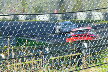 Security fence on racing circuit - Stockphoto
