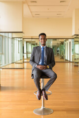Portrait of handsome African businessman wearing suit and tie