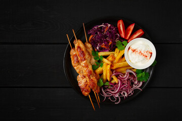 Arabic traditional cuisine, Shish tawk with potatoes and red cabbage salad, homemade, no people,