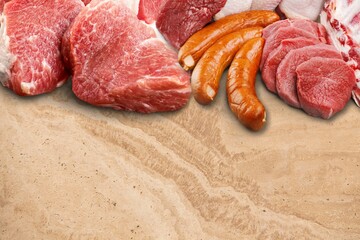 Set of different types of sausages, salami and smoked meat on the desk