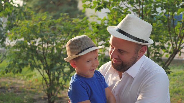 A Little Boy Hugs His Beloved Father, Dad Is In The Arms Of His Son, Happy Family Life, Father's Day, Raising A Kid In Family, Child Life With An Older Parent, Raising Baby As Man, Cheerful Childhood