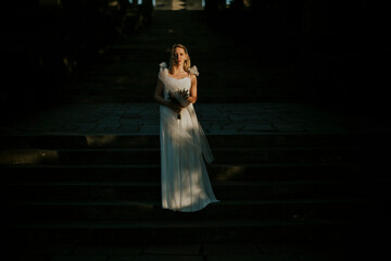 Cute bride with flower bouquet