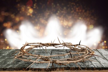 Crown Of Thorns On Wooden Cross With Sparkling In Background