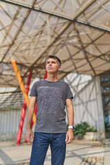Fototapeta premium adult person standing in front of a modern colorful building