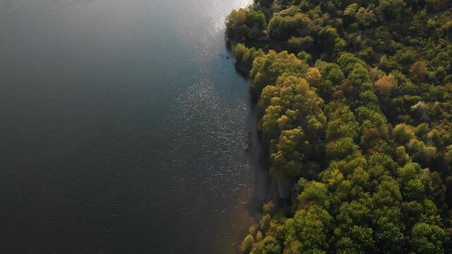 Summer aerial view on Dniester reservoir in the sunny day. High cliffs reflecting in calm blue wide water. Bakota Bay, National Nature Park Podilski Tovtry, the Dniester River, Ukraine.