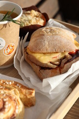 Tray with snacks and tea on a wooden table in the street