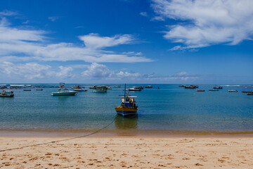 Fototapeta premium Boats and speedboats on the coast of Praia do Forte - Bahia
