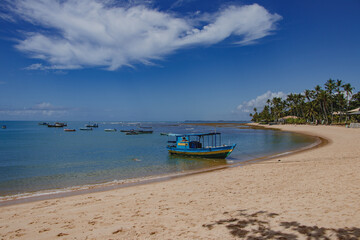 Fototapeta premium Boats and speedboats on the coast of Praia do Forte - Bahia