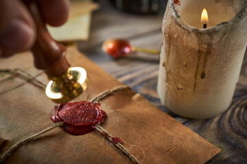 Sealing wax on ancient papers, antique stamp, and old documents, brass spoon 