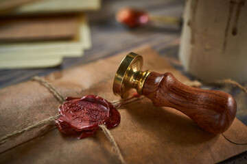 Sealing wax on ancient papers, antique stamp, and old documents, brass spoon 
