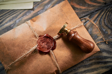 Sealing wax on ancient papers, antique stamp, and old documents, brass spoon 