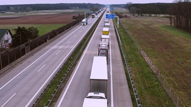 A traffic jam with a long queue of trucks on a German motorway.