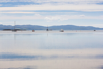 Yachts and lighthouse in beautiful Scottish Loch Fyne on a lovely summers day. 