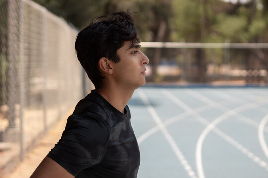 Young Man In Profile At Running Track 