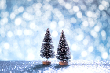 Closeup - Christmas tree toy with snow bokeh. Christmas holiday celebration and new year 2022...