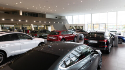 luxury cars in the interior of a car dealership, blur photo