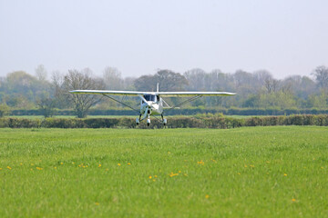 Ultralight airplane taking off	