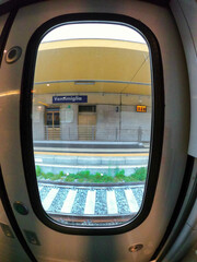View of a railway station visible from a train in Ventimiglia, Italy