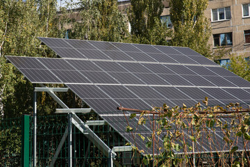 Solar panel power generation near a small vineyard in an urban area