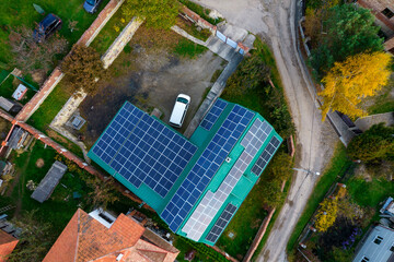 Solar panels on the roof of a modern house. Solar panels on a green roof. Concept of saving...