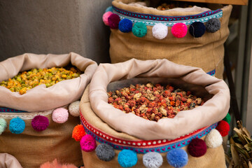 Morrocan local market on the streets with spices, nuts, fish, fruits and vegetables.
