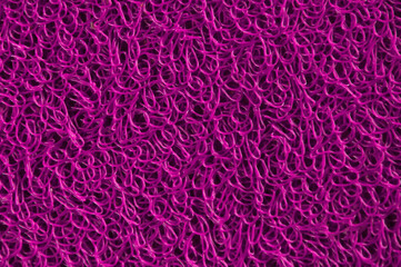 pink rug. purple unusual background. fuzzy creative surface