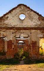 Old vintage abandoned medieval villa. Red brick ruins