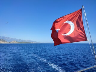 the Turkish flag is flying over the sea