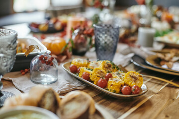 Close-up of exotic dish with vegetables on the plate on dining table serving for dinner