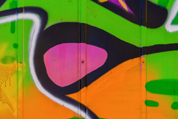 Abstract detail of urban street art design on metal wall close-up. Aerosol picture, modern background