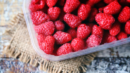 Fresh raspberries in a tray. Organic food.