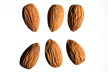 several almonds on a white background. close-up. view from above.