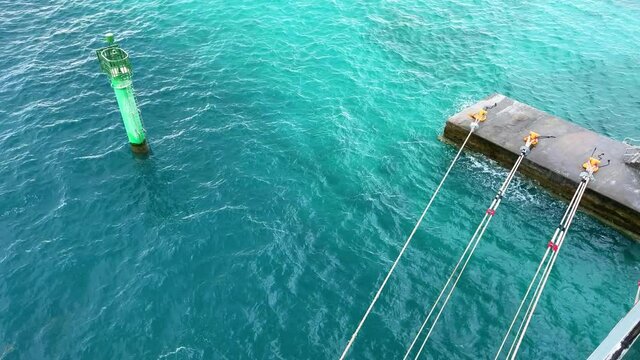 Cruise ship dock lines and splashing ocean  at  MSC Cruise Lines private island  Ocean Cay in the Bahamas.