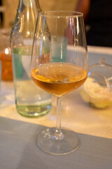 Summer on French Riviera Cote d'Azur, drinking cold rose from Cotes de Provence on outdoor terrase in old cafe, Var, France