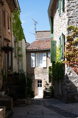 Fototapeta na wymiar Walking on ancient french village Grimaud, touristic destination with ruines fortress castle on top, Var, Provence, France