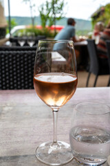 Summer on French Riviera Cote d'Azur, drinking cold rose  wine from Cotes de Provence on outdoor terrase in cafe